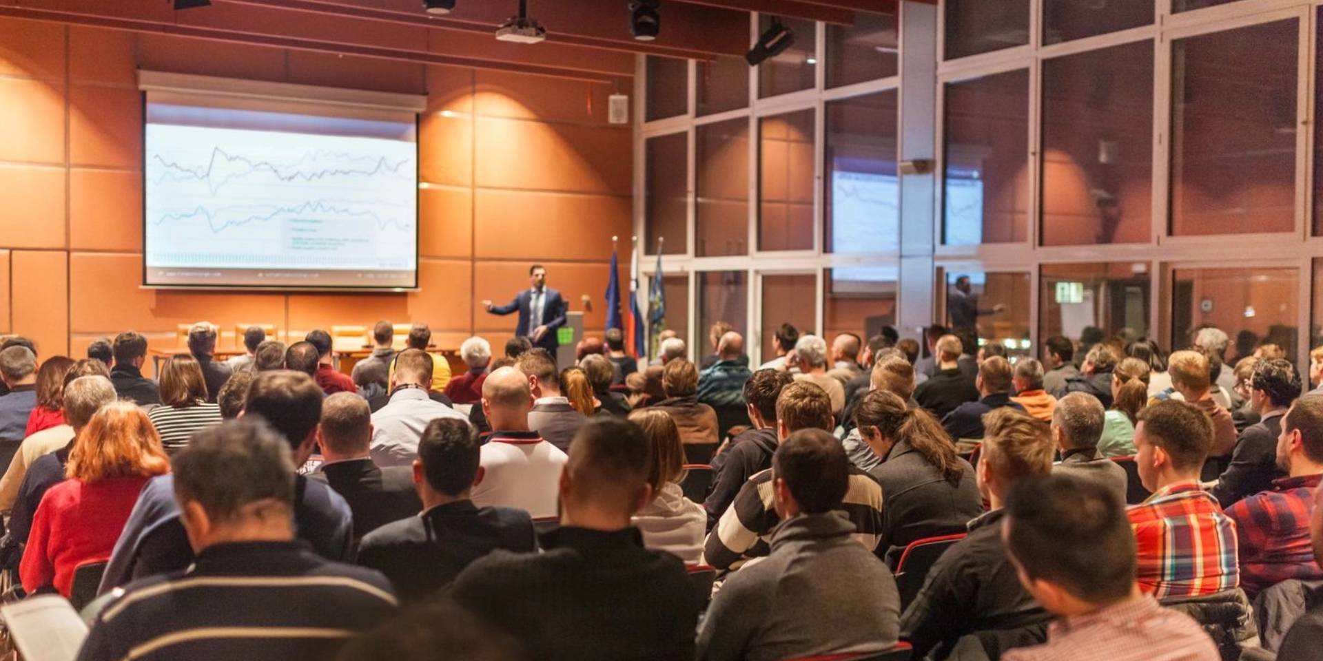 A large crowd of people in an auditorium.