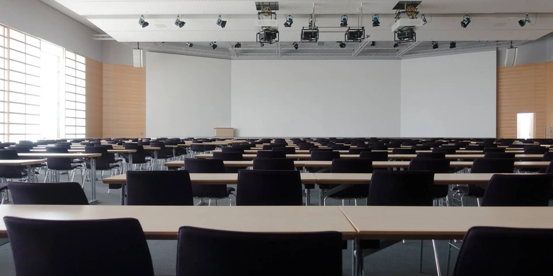 A room with many chairs and tables in it